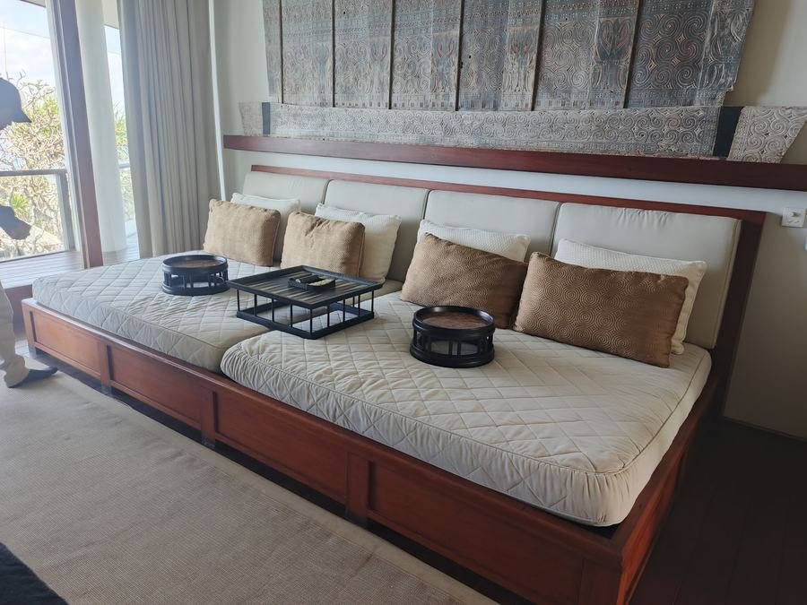 Deep daybed sofa with a timber frame and quilted cushions